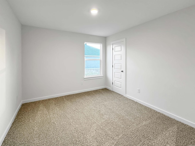 spare room with carpet floors