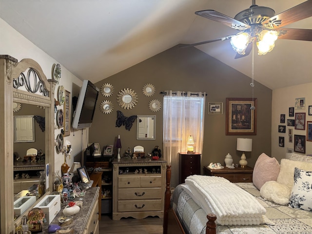 bedroom with ceiling fan, hardwood / wood-style floors, and lofted ceiling