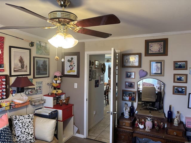 tiled home office featuring ceiling fan and ornamental molding