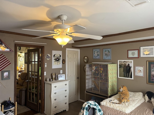 bedroom featuring ceiling fan and crown molding