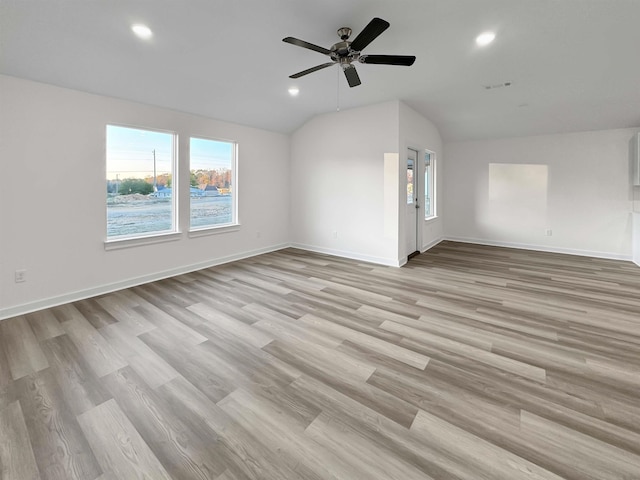 unfurnished living room with ceiling fan, light hardwood / wood-style flooring, and vaulted ceiling