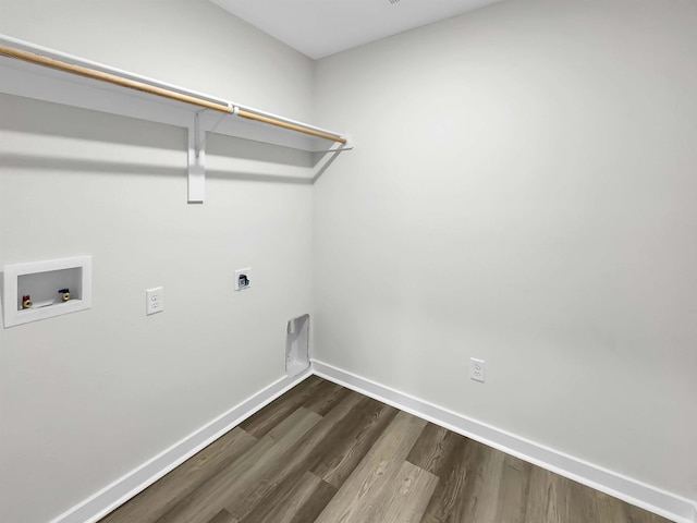 clothes washing area with hookup for an electric dryer, washer hookup, and dark hardwood / wood-style floors