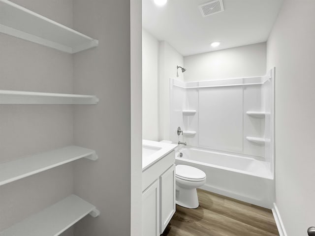 full bathroom with vanity, toilet, shower / bath combination, and wood-type flooring