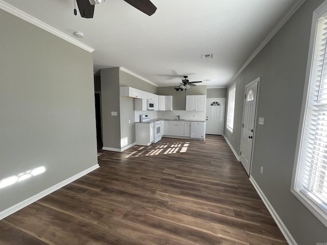 kitchen with ceiling fan, dark wood-type flooring, white cabinetry, white appliances, and ornamental molding