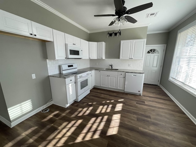 kitchen with sink, white cabinets, white appliances, ornamental molding, and decorative backsplash