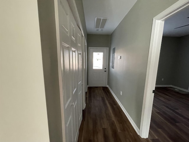 hallway with dark wood-type flooring