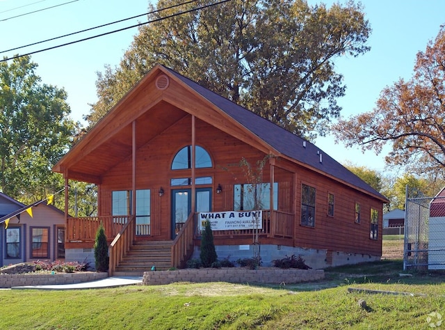 log home with a front yard