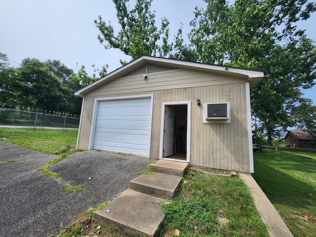 garage featuring a yard