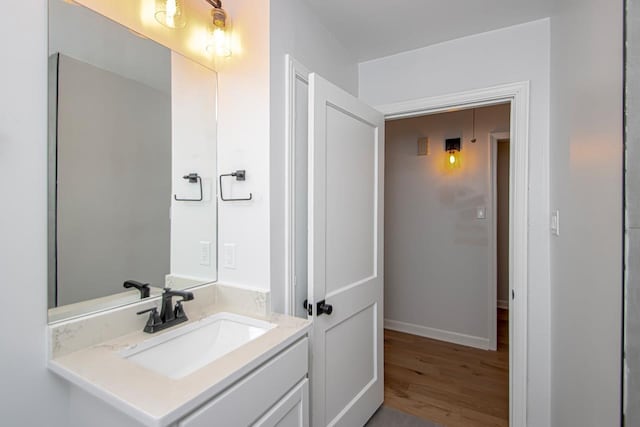 bathroom with vanity and hardwood / wood-style floors