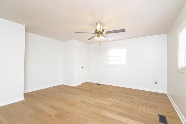 unfurnished room with plenty of natural light, ceiling fan, and light hardwood / wood-style flooring