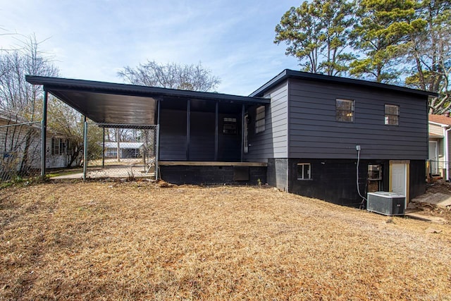 rear view of house with central air condition unit