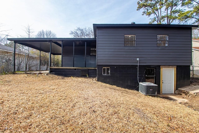 back of property with central air condition unit