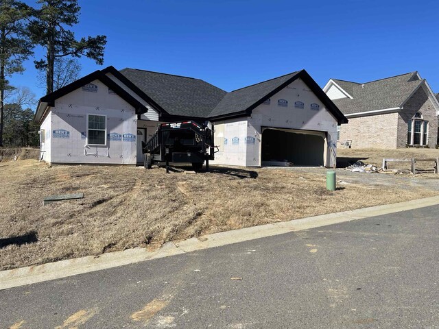 unfinished property with a garage