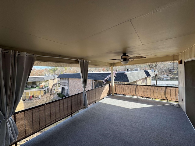 view of patio / terrace with a balcony and ceiling fan