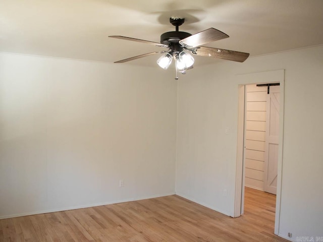 spare room with ceiling fan and light hardwood / wood-style floors