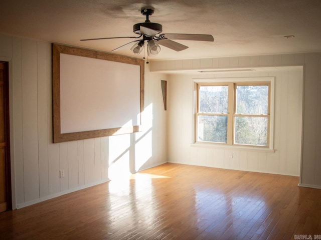 empty room featuring light hardwood / wood-style flooring and ceiling fan