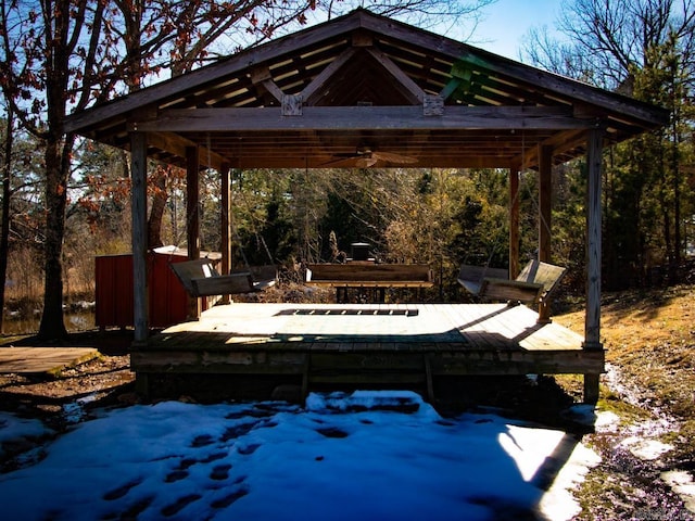 snow covered patio featuring a gazebo