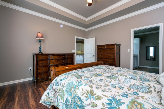 bedroom featuring ceiling fan, connected bathroom, ornamental molding, and dark wood-type flooring