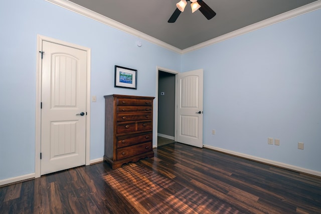 unfurnished bedroom featuring ceiling fan, dark hardwood / wood-style flooring, and ornamental molding