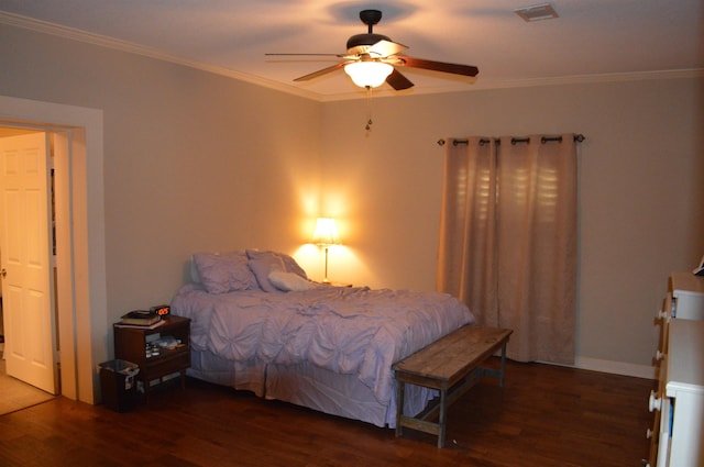 bedroom featuring crown molding, dark hardwood / wood-style floors, and ceiling fan