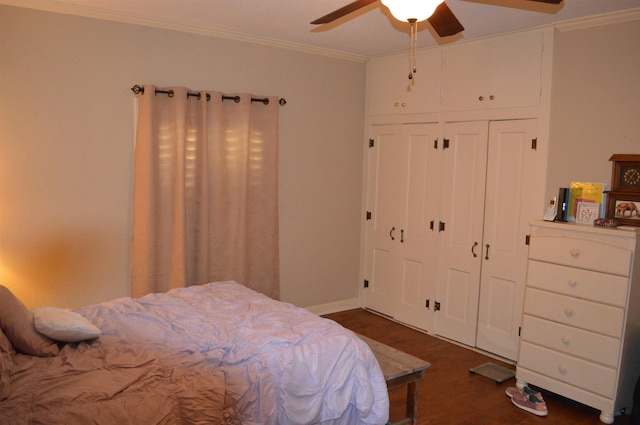 bedroom featuring dark hardwood / wood-style flooring, a closet, ceiling fan, and ornamental molding