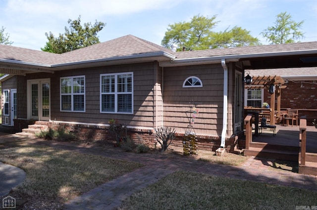 exterior space with a pergola, a lawn, and a wooden deck