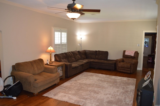 living room featuring ornamental molding, ceiling fan, and dark hardwood / wood-style flooring