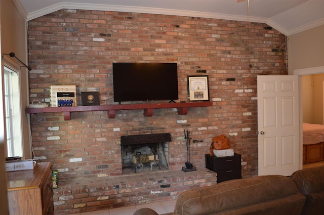 living room featuring a fireplace, tile patterned flooring, ornamental molding, and vaulted ceiling