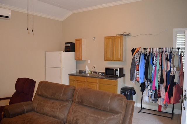 interior space with white fridge, light brown cabinetry, sink, ornamental molding, and a wall mounted air conditioner