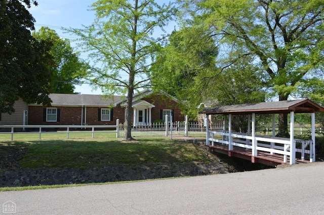 dock area featuring a lawn