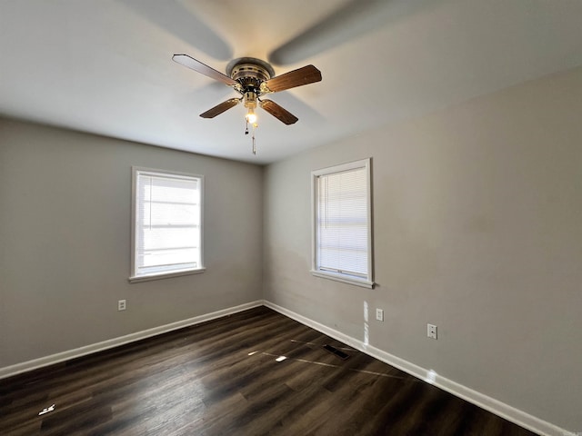 unfurnished room featuring dark hardwood / wood-style floors and ceiling fan