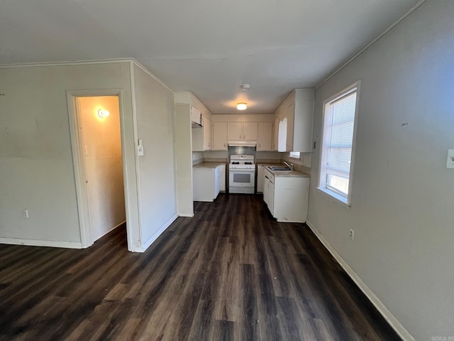 kitchen with sink, white cabinetry, dark hardwood / wood-style floors, and gas range gas stove