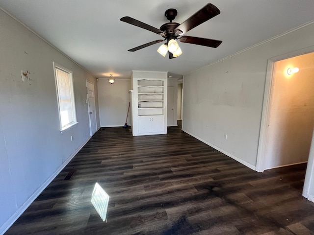 interior space with dark wood-type flooring and ceiling fan