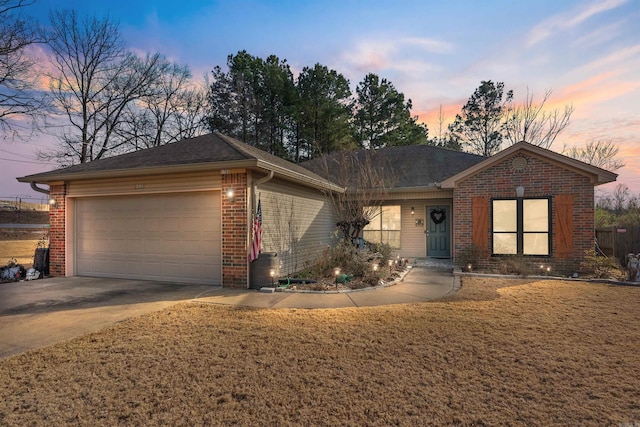 ranch-style home featuring a garage