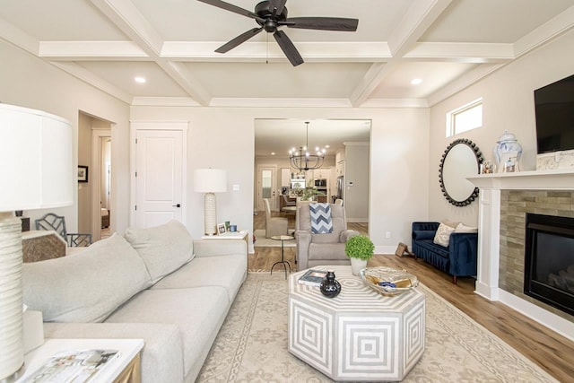 living room with light hardwood / wood-style floors, beam ceiling, and coffered ceiling