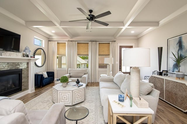 living room with coffered ceiling, beam ceiling, and hardwood / wood-style floors