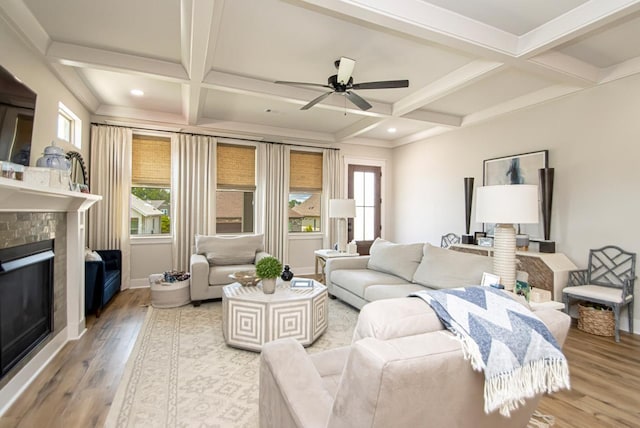 living room with coffered ceiling, hardwood / wood-style flooring, and beam ceiling