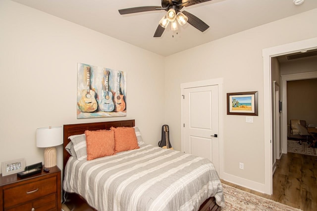 bedroom featuring ceiling fan and hardwood / wood-style floors