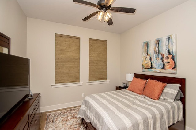 bedroom featuring ceiling fan and hardwood / wood-style flooring