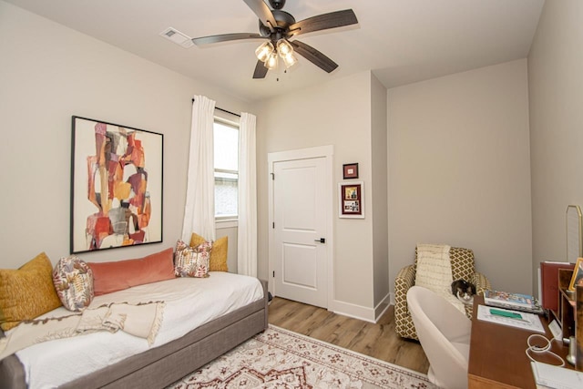 sitting room featuring ceiling fan and light hardwood / wood-style flooring