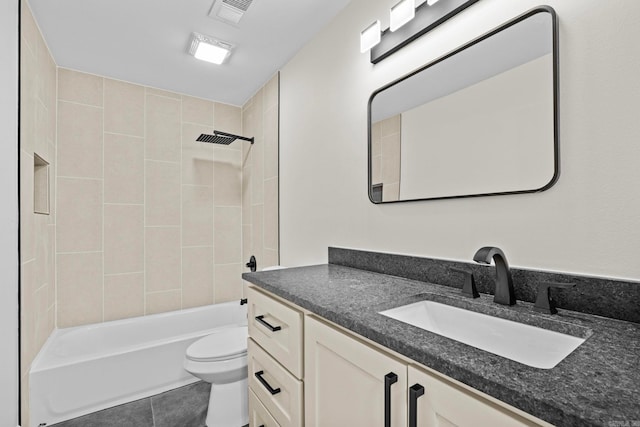 full bathroom with toilet, vanity, tiled shower / bath, and tile patterned flooring