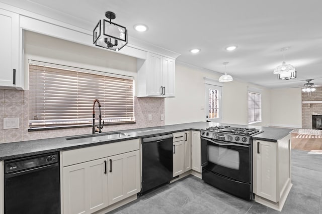 kitchen featuring black appliances, white cabinetry, a brick fireplace, hanging light fixtures, and sink