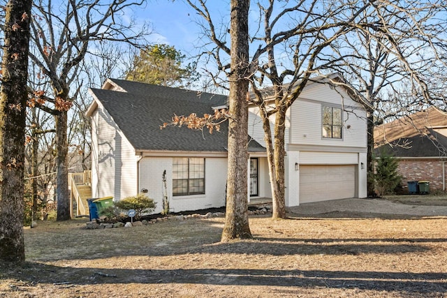 front of property with a garage