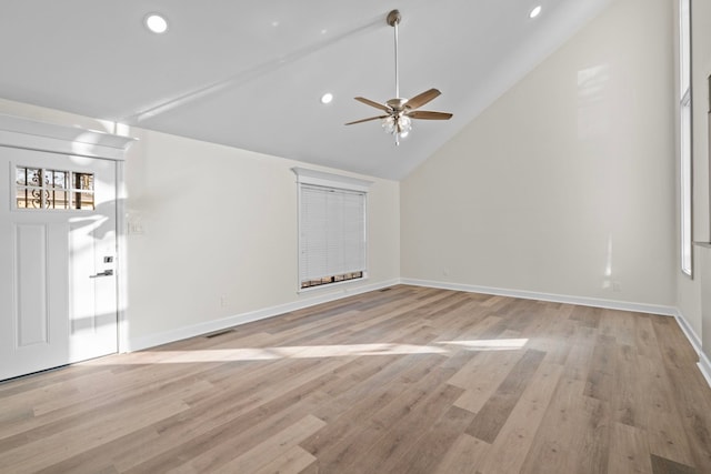 unfurnished living room featuring high vaulted ceiling, ceiling fan, and light wood-type flooring