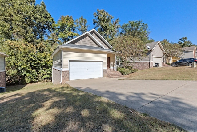 view of front of home with a garage and a front yard