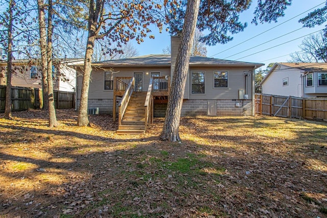 back of house featuring a wooden deck and central AC