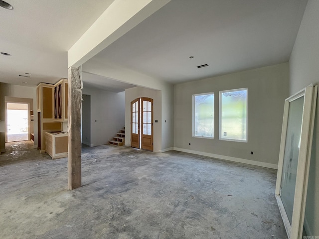 19100 Waterview Meadow Ln, Roland, AR 72135 - unfurnished living room featuring stairway and concrete flooring