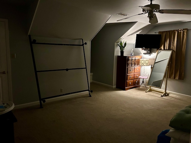 interior space with ceiling fan and carpet flooring