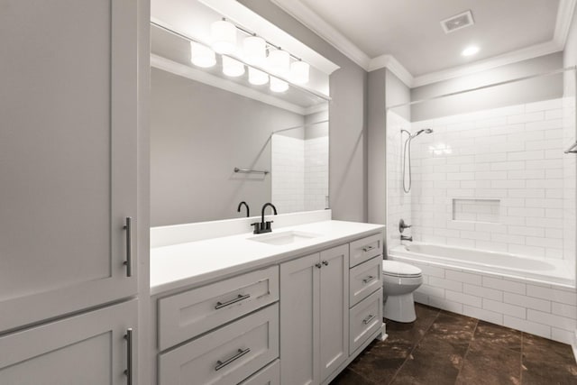 full bathroom featuring vanity, tiled shower / bath combo, ornamental molding, and toilet