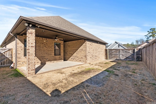 rear view of house with a patio area and ceiling fan